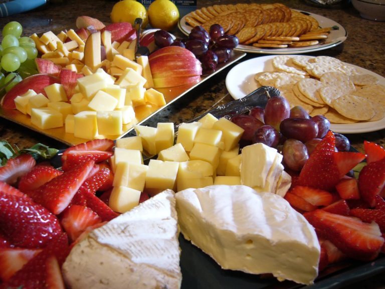 Brie cheese and fruit platter with grapes and crackers